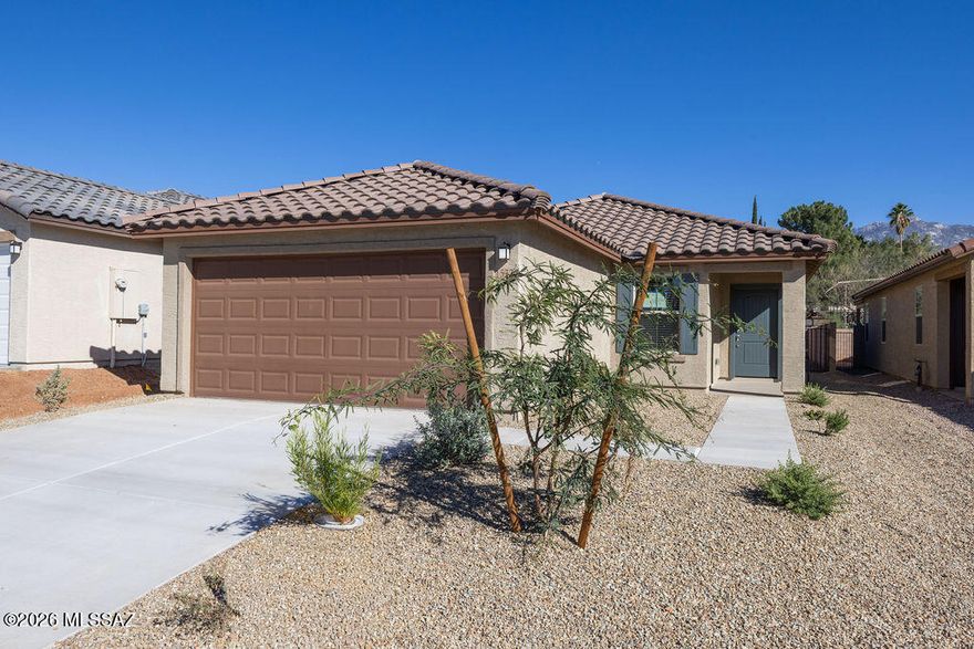 This beautiful, single-story home showcases an open floor plan with porcelain tile flooring throughout and a spacious great room. The well-appointed kitchen boasts elegant granite countertops, 42-in. upper cabinets, an island, pantry, and Whirlpool® stainless steel appliances. A versatile den provides space for a home office or playroom. The primary suite features a walk-in closet and connecting bath with a raised dual-sink vanity and walk-in shower. Relax outdoors on the covered back patio. Price includes discount predicated on using seller's preferred lender KBHS.
