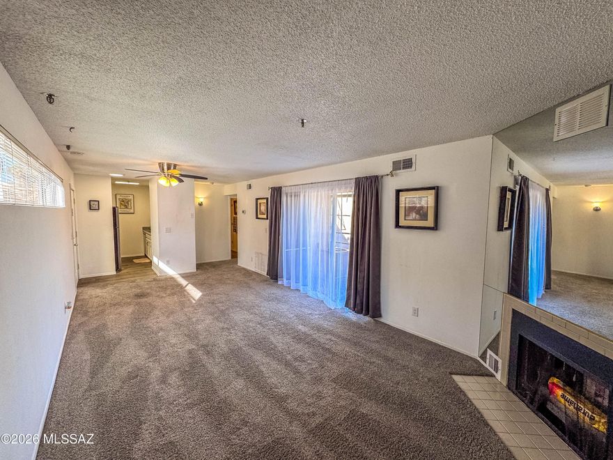 One bedroom one bath gem! This condo offers a cozy fireplace, balcony with views, assigned covered parking. Close to Pima community College, University of Arizona, I-10 and great Downtown shopping and restaurants. 
HOA includes water. landscaping and trash pickup.
