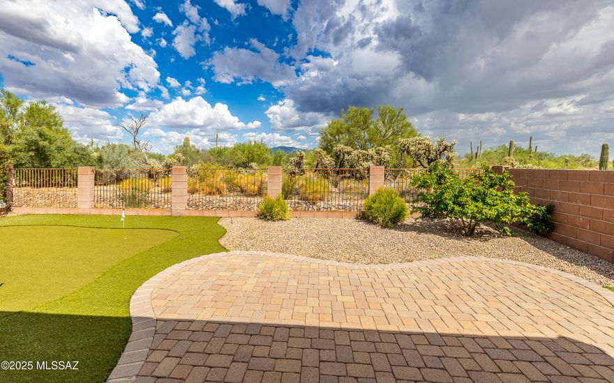 Private and serene location - located in gated Preserve community.  Limited traffic subdivision.  3 bedrooms + open space room for den/office/library/crafts. Wide open great room concept plan. Kitchen opens nicely to great room and hosts stainless steel appliances and lovely staggered cabinetry. Very nice laundry room with folding station, sink and abundant storage cabinets. Lovely plantation shutters can be found throughout home. Fabulous backyard w/beautiful extended brick pavers, putting green., Catalina and Tortolita Mountain views plus backs to nature.  It's a great backyard.