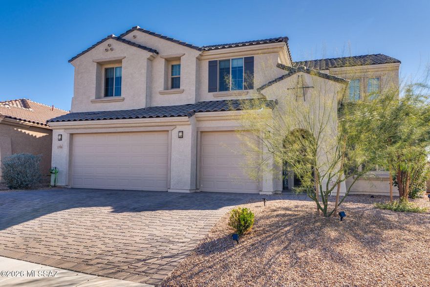 Discover this highly upgraded Pulte Messina floorplan in the coveted Rocking K community within the award-winning Vail School District. This spacious home offers 6 bedrooms, 4.5 baths, a loft, den, and 3-car garage. The chef's kitchen features KitchenAid® appliances, granite countertops, designer pendants, soft-close cabinetry. Upgraded patio doors from the dining and living areas open to a stunning backyard with covered patio, electronic sunshades, pavers, turf, pergola, view fencing, and breathtaking mountain views, with room to add a pool. Additional upgrades include laundry room cabinetry with sink and backsplash, staircase banister, custom closet inserts, epoxy garage floors, and more. Enjoy Rocking K's 20-acre park, courts, splash pad, trails and serene dessert surroundings.