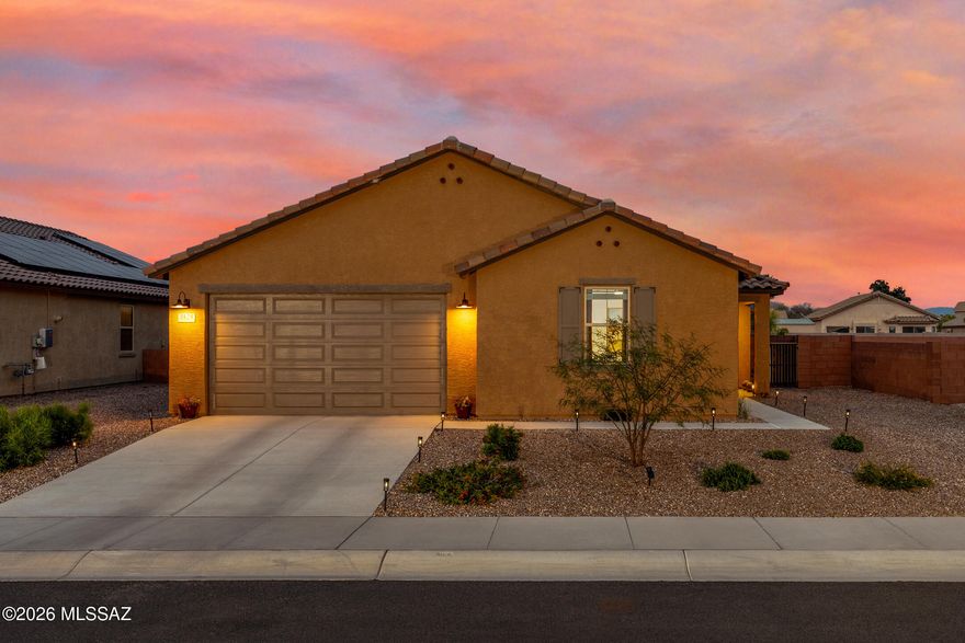 This inviting single-story home offers a bright, open floor plan with 9-foot ceilings and wood-look porcelain tile flooring throughout the main living areas. The modern kitchen is designed for both function and style, featuring granite countertops, maple cabinetry, a large center island, walk-in pantry, and stainless steel appliances. A versatile den provides the perfect space for a home office, flex room, or hobby area.

The primary suite is relaxing, with a walk-in closet and an en-suite bath showcasing dual sinks and a walk-in shower. Two additional bedrooms and a full bathroom offer comfort and flexibility for guests or everyday living. Step outside to the covered patio and enjoy a thoughtfully designed backyard featuring a hot tub, putting green, and stunning mountain views - ideal for entertaining or unwinding. Additional highlights include a tankless water heater and paid solar, offering energy efficiency and long-term savings. Your next chapter starts here!