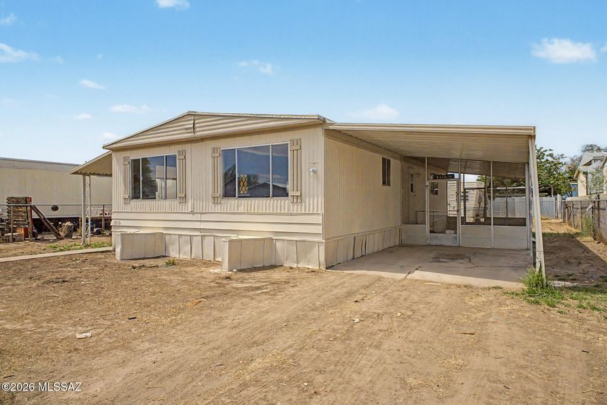 Charming 2-bedroom, 2-bath manufactured home offering 1,152 sq ft of comfortable living space on a 6,011 sq ft lot with no HOA. Features include a family room, breakfast bar, gas range, laminate countertops, laundry closet, and a covered/enclosed patio -- perfect for outdoor enjoyment. Forced air heating and natural gas utilities. Brand new central A/C unit to be installed prior to closing with an accepted offer. One covered carport space. The mobile home in the back conveys as-is -- it has utilities connected and can remain or be removed at buyer's discretion. Vacant and easy to show. Owner/Agent.