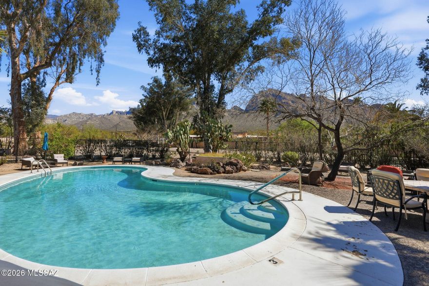 Enjoy peaceful mountain views from this upstairs corner condo in desirable Oro Valley. This charming home offers added privacy and natural light, with a private back patio overlooking a quiet common area and scenic mountains. The unit has been thoughtfully maintained, HVAC replaced in 2021, and refrigerator in 2025. The community is surrounded by mature vegetation and features a relaxing pool area with incredible mountain views-perfect for enjoying Arizona's sunshine. HOA covers roof, exterior maintenance, water, sewer, and garbage to make for easy living.  The property includes one reserved parking space and is within walking distance to The Loop Path, offering miles of scenic walking, hiking and biking trails. Don't miss this opportunity to own a peaceful Oro Valley retreat.