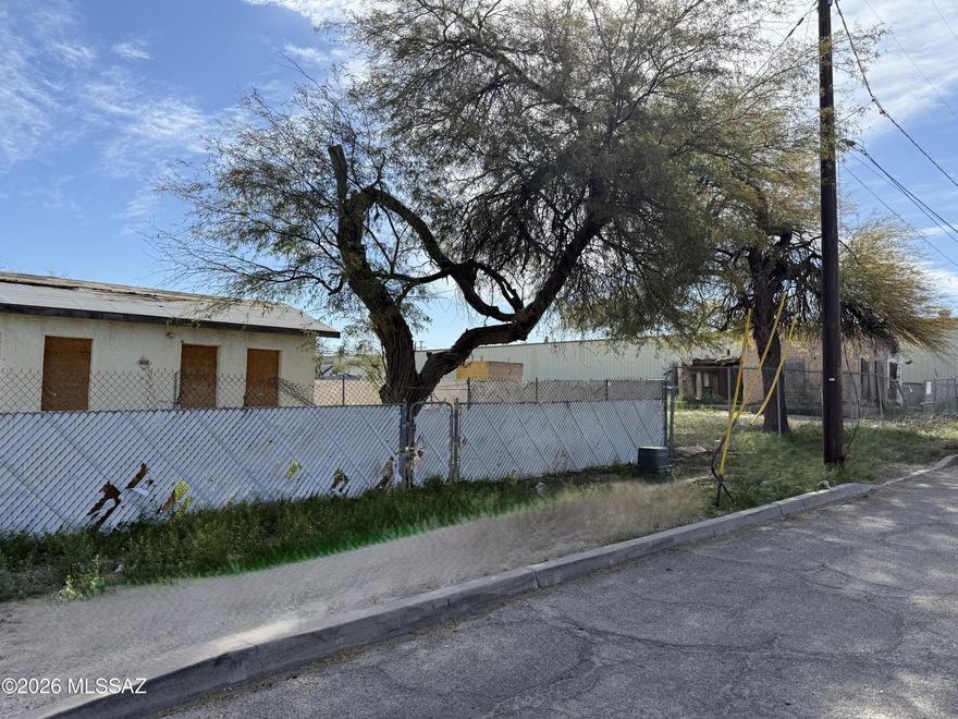 DEVELOP this R-3 tax-advantaged OPPORTUNITY ZONED lot in Central Tucson just north of Downtown, between University of Arizona/Banner UMC & St Mary's Medical Park, in heart of the GEM SHOW. Street dead ends into Estevan Park w/playground, basketball, soccer/rugby, walking paths. In the historic Dunbar Springs Neighborhood. ADJACENT PARCEL ALSO FOR SALE, see MLS 22607156. HIGH DENSITY R-3 zoning may allow < 6 units, < 40ft height. Or, use for industrial or commercial as it's surrounded by R-3 & C-3 industrial, commercial and residential developments. Use your imagination. Alley access enhances accessibility. Note, for full land development, existing 1930/1940 small structures will need to be demolished, or restore them & add more