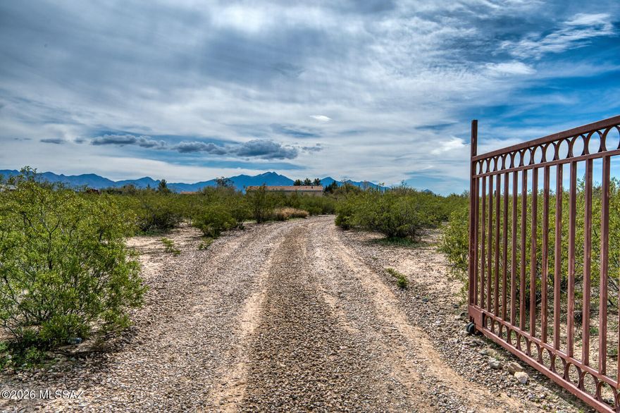 Enjoy wide-open space and stunning views of Mt. Wrightson from this 3-bedroom, 2-bath manufactured home set on 4.4 flat, usable acres. The level land offers endless possibilities—bring your horses, add horse facilities, or create the rural setup you've been dreaming of. With room to grow and panoramic scenery in every direction, this property combines comfort, flexibility, and peaceful country living. Property is served by a shared well. Buyer to verify all items and what is allowed on property per the zoning.