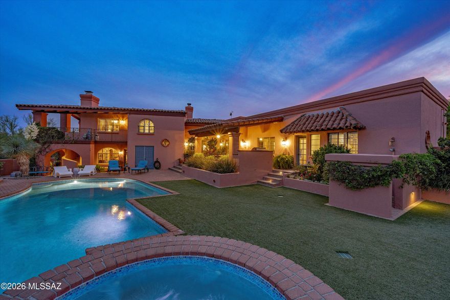 Nestled in the highly desirable, gated Catalina Foothills Estates No.10, this stunning 4BR/4BA/Den home offers the perfect blend of privacy, comfort and breathtaking desert beauty. Inspired by the Arizona Inn's Spanish Revival style, this home is situated on a spacious 2.1 acre lot, with the 3840 sf residence capturing sweeping mountain and city views, creating a serene backdrop for everyday living.
From the moment you step into the tranquil courtyard and enter the home, you will find a thoughtfully designed split bedroom floor plan featuring generous living spaces, ample natural light, and elegant finishes throughout. 
The kitchen is well-appointed with abundant cabinetry and counter space, ideal for both everyday use and entertaining. The primary suite provides a peaceful retreat with a spacious layout and welcoming ensuite bath, complete with walk in shower, separate vanities and beautiful views to the north.
Additional living areas include a formal living room, family room, dining area and den.  Together with three guest bedrooms (one with ensuite bath), this home provides the space desired in a home of this caliber.
Outdoors, the property truly shines. The expansive lot provides privacy and endless possibilities--whether you enjoy the infinity edge, resort-style pool/spa, outdoor shower, entertaining spaces, or simply take in the serene desert landscape and unparalleled mountain views. The elevated setting enhances both views and tranquility, a hallmark of this exceptional property.
The home is completed with a large, 3 car garage containing ample storage and a mini split hvac for those warmer days.
Conveniently located near upscale dining, shopping, and outdoor recreation, this home offers both tranquility and accessibility. A rare opportunity to own in one of Tucson's most sought-after neighborhoods.