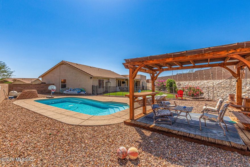 Welcome to this stunningly updated home nestled on a quiet cul-de-sac in the highly sought-after Dove Mountain community. Showcasing over 1,900 sqft of beautifully remodeled living space, this move-in ready gem features brand-new countertops, modern flooring, stainless steel appliances, and a thoughtfully designed addition that includes a gorgeous new bathroom. Step outside to your private backyard oasis--perfect for entertaining or simply unwinding. The spacious yard features a sparkling pool, a stylish pergola, and a second outdoor entertaining area ideal for gatherings under the stars. Enjoy the unbeatable location--within walking distance to the highly rated Dove Mountain C-STEM K-8 School, scenic parks and the popular Dove Mountain Brewery.
