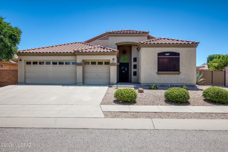 Beautifully maintained 4-bedroom, 2-bath home with a desirable split-bedroom floor plan on a premium corner lot backing to a common area. Enjoy Arizona living in the backyard oasis featuring a saltwater pool with waterfall, large grassy area, and citrus trees. Spacious kitchen offers granite countertops, stainless steel appliances, a large island with breakfast bar, and new refrigerator. Fresh interior paint and new carpet in the bedrooms add a move-in-ready touch. The primary suite includes a walk-in closet, dual vanities, soaking tub, and separate walk-in shower. Tile flooring runs through the main living areas. Additional highlights include new water heater, 3-car garage, and a prime location in the highly desirable Vail School District near shopping, dining, and everyday conveniences.