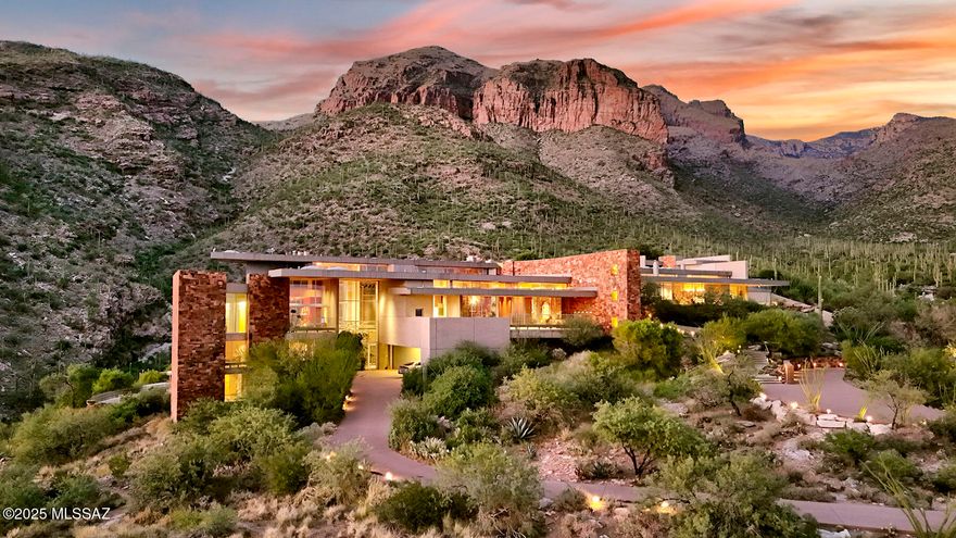 Timeless architecture plus exceptional setting equals Campbell Cliffs. Sited on 6 plus acres of high Sonoran desert with over a million acres of protected national forest as your backyard. Main living areas all on one level approx 9000 sq ft primary bedroom/bath, entertainment room, living & dining rooms, kitchen & 2 offices, plus home theater.  Many other amenities: 3 Br/Ba guest level, 2400 sq ft guest/staff house, lower level 2000-bottle wine cellar, hobby room, workshop & Olympic sized gun/archery range. Healthy living with pool/spa, tennis court and 2-level gymnasium w/aerobic & weight machines, sauna, steam room, and rock climbing wall. Also offers security with 24-hour guard-gate & safety patrol. For more info & pictures visit campbellcliffs website.