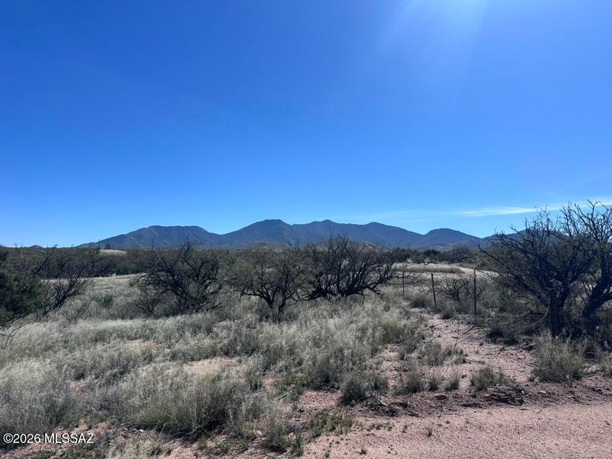 Discover the perfect blend of space, freedom and location with this 12ac vacant land parcel offering breathtaking mountain views and endless possibilities.  The property features a prepared house pad, is fenced and is ready for your custom home vision to come to life.  The property carries Agricultural status, offering potential tax advantages while maintaining flexibility for your rural lifestyle goals. Bring your horses, build your dream shop, create the ranch lifestyle you've been wanting.  This is true horse property with room to roam.  Convenient quick access to I-10 makes commuting to Tucson or Sierra Vista simple while still enjoying the peace and privacy of wide-open spaces. Rare acreage, mountain views no HOA, and prime location.  Don't wait!  Call today!