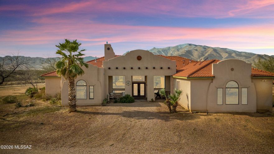 Gorgeous custom estate tucked away at the base of Cochise Stronghold. Property features 4 bedrooms, 2.5 baths, a great layout with designer kitchen with island that opens to a great room with stone fireplace. The home is well appointed with heated title flooring and unique accents throughout the home. The backyard is an outdoor oasis with in-ground pool and Cochise Stronghold views. Detached Garage and workshop. 1 mile from Forest access for hiking and riding. 

***Optional adjacent 4 acres of flat useable land that includes 1/4 well share, 200 amp electric, septic installed, Concrete pad is poured and ready for a 40X60 Muller Metal Shop that is included (building is not erected). See MLS#: 22505915