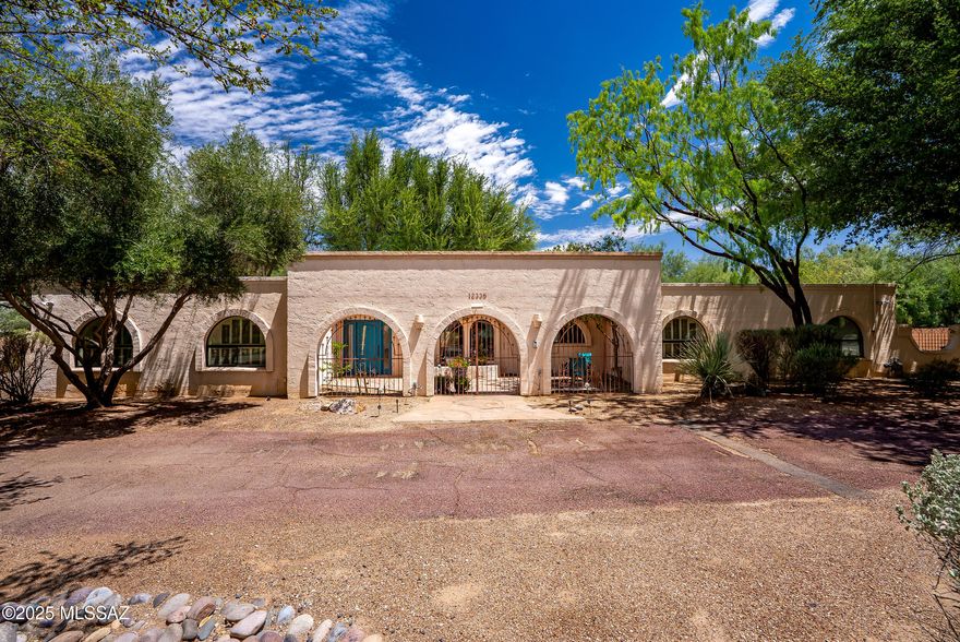 Bright and spacious home located in the desirable 49er's CC and the Tanque Verde Valley. Fantastic curb appeal with circular driveway and separate access to garage. This home offers 5beds/3bath plus lots of versatile space, living room, family room with fireplace, and formal dining. Beautiful kitchen with wood finish hood, stainless appliances, and  kitchen sink window over looking the courtyard. Huge primary suite with fireplace, 2 separate vanities, beautiful walk in shower, and large walk  in closet. Tons of mature trees in front and back yard providing plenty of natural shade to cool down those summer month weekends. Spacious lot with private gate accessing the garage for additional security. A true must see!