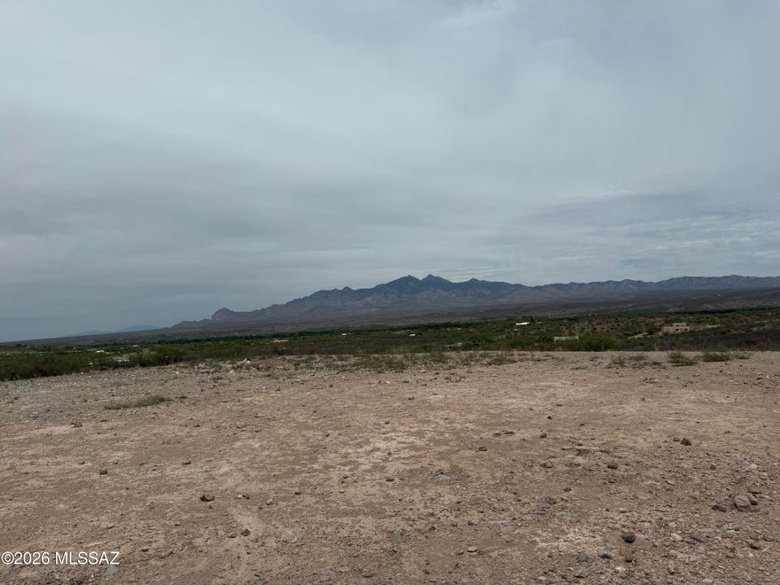 Enjoy the best of both worlds with this beautiful 4+ acre parcel offering the charm and privacy of country living while still enjoying the conveniences of a neighborhood setting. Take in sweeping views of the Tumacácori and Santa Rita Mountains along with the stunning Santa Cruz River Valley. The property features a shared well and storage tank already in place, plus phone and electric available to the lot -- making it ready for your dream home. A homesite pad has already been cleared, giving you a head start on building. Located just a short drive from Tubac, you'll have easy access to shopping, dining, golfing, hiking, and all the unique charm the area has to offer. The owner has a set of building plans available for the property!