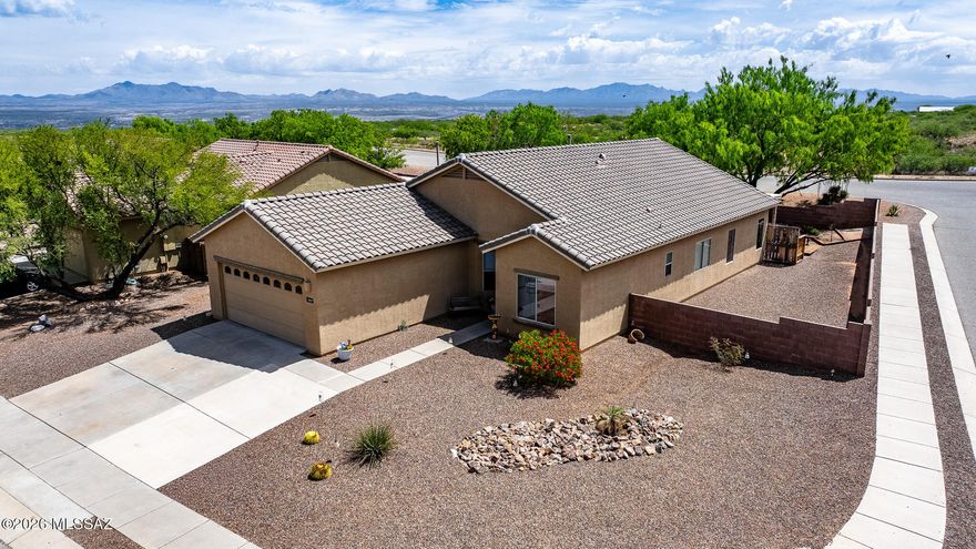 This spacious 4-bedroom, 2-bath home offers approximately 1,899 sq ft of comfortable living space with an open floor plan and abundant natural light. The kitchen features granite countertops and plenty of storage, perfect for entertaining. Tile flooring flows through the main living areas for easy care, and a convenient floor outlet in the living room adds functionality. Step outside to a generous backyard complete with a hot tub spa and a natural gas hookup for a BBQ, ideal for relaxing or hosting gatherings. Conveniently located near I-10 for an easy commute. A wonderful home in a desirable area in Benson!