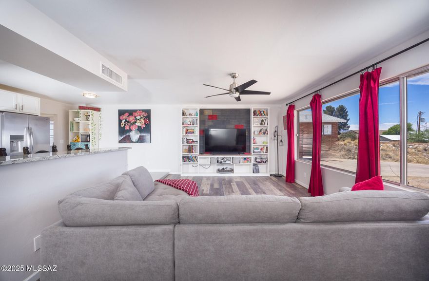 Welcome to your dream home! This beautifully remodeled 4-bedroom, 2-bath residence offers an open-concept layout perfect for modern living. The spacious family room features a stunning fireplace, creating a warm and inviting atmosphere. Enjoy breathtaking views of the surrounding mountains from the comfort of your own home. The kitchen and bathrooms are adorned with granite countertops throughout, adding a touch of elegance to every space. A detached garage includes a bonus room, offering flexible space for an office, studio, or guest area. Conveniently located close to shopping, schools, and medical facilities, this move-in-ready home is waiting for you!