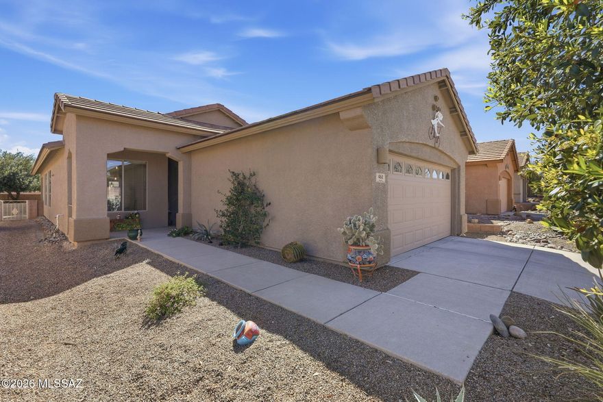 Discover refined desert living in this immaculate turnkey home in the gated, age restricted Las Campanas community. This elegant 2 bed + office residence features a bright great room, kitchen with granite counters, stainless appliances, gas range, butler's pantry, wine cooler, & pull out shelving. The split bedroom design offers a serene primary suite with double vanity bath and walk in closet. Enjoy mountain views from the beautifully landscaped, low care yard with artificial turf, covered patio, & pavers. Additional highlights include tile roof, water softener, natural gas systems, & a 2 car garage with utility sink. Residents enjoy premier Green Valley Recreation amenities including pools, pickleball, fitness, rec centers & more.