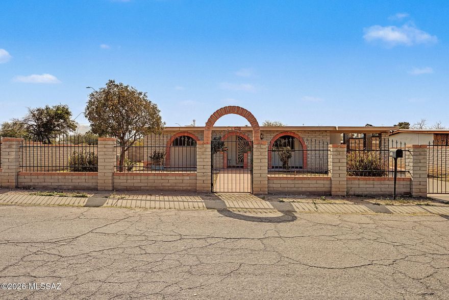 Welcome to this Southwestern Ranch style home with 2 beds, 2 baths, and 1,127 SF of updated living. This home features updated bathrooms, new flooring throughout, and a generously sized primary suite with walk- in closet. The large front and back yards are fully enclosed and include a detached shed for added storage. A classic brick exterior with arched entryways enhances curb appeal. Well-maintained, move-in-ready, and filled with potential for outdoor living.