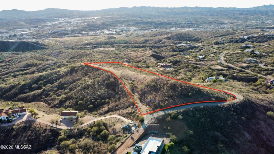 Experience the pinnacle of privacy and natural beauty with this exceptional 10 acre homesite in the prestigious Vista Del Cielo community. Nestled at the end of a quiet cul-de-sac, this expansive property offers the perfect setting to build your custom luxury estate. Wake up to breathtaking sunrises and unwind with spectacular sunsets, all while taking in panoramic views of the city of Nogales. Surrounded by serene desert landscape and open skies, this lot provides a rare sense of seclusion without sacrificing convenience. With ample space for horses, this property is ideal for those seeking both elegance and freedom. Whether you envision a sprawling estate, a private retreat, or an architectural masterpiece, the possibilities here are truly endless. Don't miss this rare opportunity to own a premier parcel where luxury, privacy, and stunning views come together in perfect harmony.