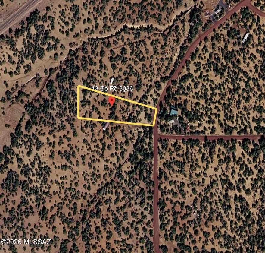 Quiet, usable 1.36-acre homesite in the trees just off County Road 3036 in Concho. This gently rolling parcel offers a cut-in driveway and leveled pad area, giving you an easy start for your RV, weekend getaway, or future cabin. Mature junipers provide privacy and shade, with open pockets that frame the surrounding high-country views. Power is available at lot line (buyer to verify connection and costs), and the property is zoned for flexible rural living with room for animals, gardens, and outbuildings, subject to county approval. Easy drive to Show Low for shopping, dining, and services. This is a great spot for someone who wants elbow room, trees, and straightforward access without being miles down a rough two-track. Buyer to verify zoning, utilities, access, and all intended uses.
