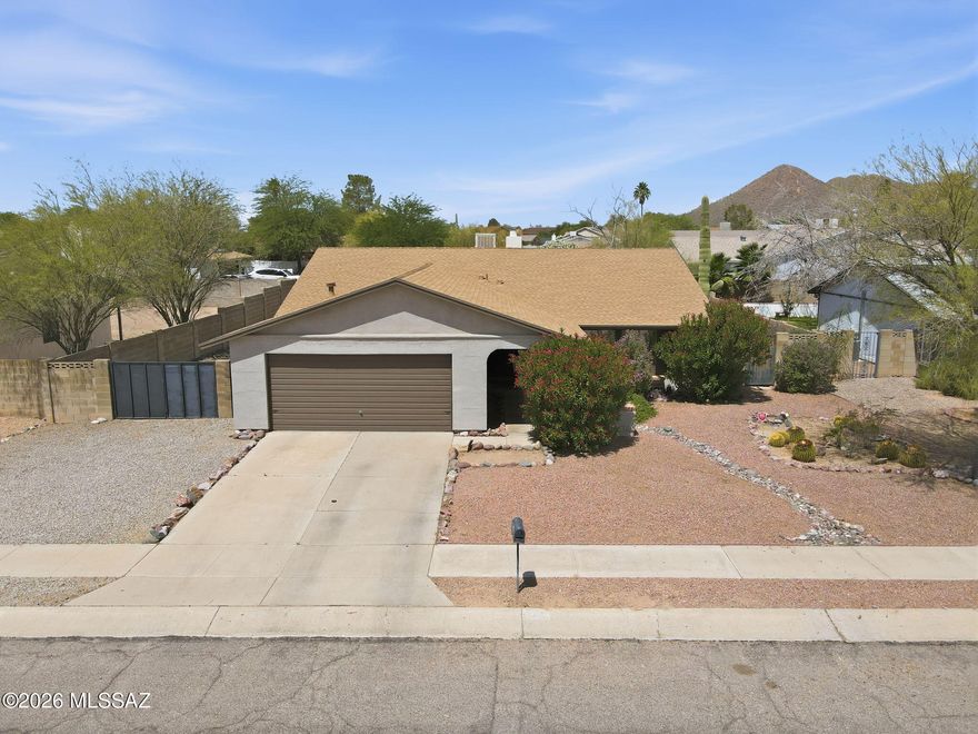 NO HOA! Welcome to this beautifully updated 4-bedroom, 2-bath home offering mountain views, mature landscaping, and a bright open layout filled with natural light. The inviting great room creates an easy flow for everyday living, while the family room fireplace adds warmth and charm. A dedicated dining   area provides the perfect space for gatherings, and the covered back patio extends your living space outdoors. The landscaped backyard is designed for low-care enjoyment and includes double gate access for added convenience. Updated, comfortable, and move-in ready-and did I mention, NO HOA!