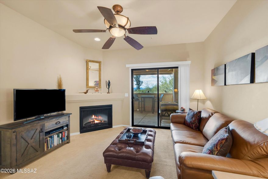 Freshly painted! Located in the gated community of Villas at Hacienda Del Sol, just steps from the scenic Rillito River Park section of the Loop, this rare freshly painted 2-bedroom, 2-bath second-floor condo offers privacy, mountain views, and direct access to walking and cycling on the paved Rillito River walk. Situated in the quiet southwest corner of the community, the desirable split-bedroom floorplan provides ideal separation for guests or a home office. Move-in ready, newer HVAC & hot water heater, the interior features granite kitchen countertops, stainless steel appliances, ample cabinetry, plush carpeting, a cozy fireplace, and a dining room for entertaining or enjoying everyday meals.