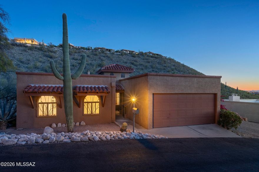 Seller shall entertain offers between $600,000 - $635,000. Looking for income potential? A home  & an Office? The scenic foothills of Sabino Canyon is the setting for this gorgeous 2 level offering sweeping views of untouched hillside saguaro desert & sparkling city lights! Two separate living areas w/a 3 bdrm/2 bath upstairs, and downstairs (1500 sq feet) 2 bdrm/1bath w/den & new kitchen. Both sections have their own entrances & NEWER ZONED HVAC. Homeowner added over $100,000 upgrades since they have owned the home. See list of upgrades attached to this listing.  NEWLY remodeled primary bathroom on main level offers a large walk in shower & will accommodate a wheelchair. Newly remodeled kitchen w/custom butcher block island. Check out the catico on west side of home off living area.