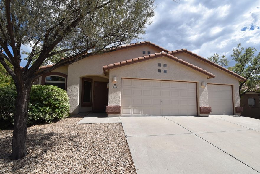 Amazing views plus 3 car garage in Oro Valley!  You will enjoy the beautiful Catalina Mountains from the spacious rear yard of this 3 bedroom, 2 bath, 3 car garage home in Rancho Vistoso/Oro Valley!  Tile flooring everywhere except 2 bedrooms with carpet.  All appliances included.  Vaulted ceilings and ceiling fans throughout.  Fireplace in family room off kitchen.  Covered patio with extended flagstone.  Convenient to shopping, restaurants, hiking, & medical facilities.  Clean & move-in ready.  1 year minimum lease. Non smoking home.  $45 application fee per adult.  Subject to credit approval.  Renters insurance required.