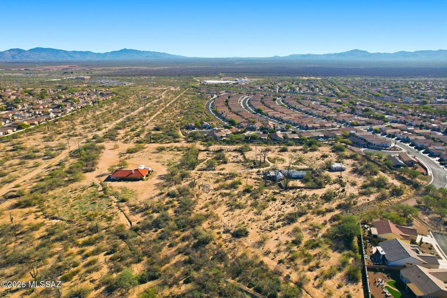 Rare Sahuarita Opportunity! This unique offering includes two parcels totaling over 8.5 acres, ideally located in the heart of Sahuarita. Formerly known as the Williams Ranch, the property features a nearly completed, fully permitted multipurpose building constructed to commercial specifications. Improvements include blown-in insulation, composite tile roof, 5-ton HVAC, ADA-compliant restrooms, and dual-pane windows already purchased and on site. Property is well equipped with two well heads, electric on site, and a completed septic system, allowing for a wide range of potential uses. Additional highlights include an easement for future sewer, water, and gas access to the east, plus town-approved dirt road access from Camino Rancheria to the west. Excellent development or investment