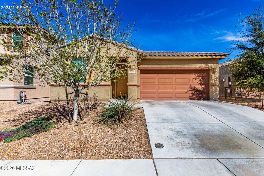 Better than new, this thoughtfully designed home features two spacious primary suites offering flexible living options. The open concept layout showcases a large kitchen with stunning granite countertops, abundant cabinetry, and generous prep space flowing into the living and dining areas. A versatile flex room works well as a den, office, or media space. New wood look plank tile flooring adds a fresh, modern touch, and natural light enhances the interior. The finished backyard offers a low-maintenance blend of turf and decorative stone. Located in Gladden Farms with extensive parks, trails, sports fields, splash pad, Huckleberry Loop access, plus convenient access to shopping, dining, and I-10.