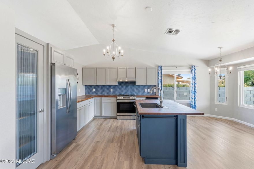 Positioned at the end of a quiet cul-de-sac in Rita Ranch within the award-winning Vail School District, this beautifully upgraded home offers privacy, no rear neighbors, and stunning Rincon Mountain views. Inside, refined wood-look luxury vinyl plank flooring flows throughout, complemented by a bright, modern kitchen featuring new cabinetry, appliances, and butcher block countertops. The adjoining family room with a cozy fireplace creates an inviting space to gather. The primary suite offers an updated bath with a newer vanity and flexible bonus space. With a newer roof, upgraded plumbing, brand-new windows, a spacious backyard, and a nearby community park, this move-in-ready home delivers comfort, style, and quality living. Seller will accept, or counter offers between $325k and $340k.