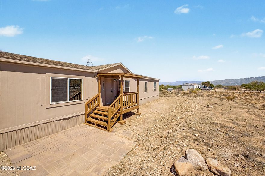 Enjoy peaceful desert living in this clean and well-maintained 4-bedroom home situated on a spacious 1-acre lot! Bring your RVs, trailers, ATVs, and all your desert toys with plenty of room to spread out and enjoy. Take in the beautiful mountain views and wide open skies while creating your own private outdoor sanctuary. This move-in ready home also features a brand-new 2026 water heater for added peace of mind. Whether you are looking for extra space, privacy, or room for outdoor living and entertaining, this property offers endless possibilities to make it your own while enjoying the beauty of Arizona living.