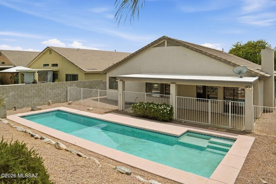 Beautiful East side Oasis with expansive living space and a sparkling lap pool. Welcome home to this light, bright retreat with high ceilings designed for an indoor-outdoor lifestyle. Features fresh paint, ceiling fans, and new carpeting. The living room flows into the kitchen which is open to the cozy family room with a gas fireplace. Both bathrooms are updated with new toilets, mirrors, and vanities. Enjoy a fenced pool & a full-length covered patio. Direct pool views from the family room and primary suite. The primary suite has double doors, and the wide hallway leads to two secondary bedrooms, and laundry room. This home features perfect North/South orientation and a 2-car garage with a storage/workshop cove. Move-in ready in popular Austin Point, minutes from shopping and entertainmen