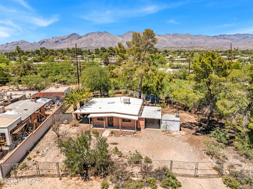 OWNER-AGENT As-is opportunity with classic mid-century charm near Tucson's Loop path system. Set on a usable lot with room to reimagine the property, this home offers strong potential for an investor, contractor, or buyer looking for a value-add project in an established east/central Tucson location. The lot provides flexibility for outdoor living, storage, workspace, garden areas, or future improvements, subject to buyer verification. Convenient access to The Loop, nearby parks, shopping, dining, and major east/west corridors adds to the long-term appeal. Property is being sold strictly as-is. Buyer to verify all facts, figures, utilities, condition, permits, zoning, square footage, lot use, financing eligibility, and suitability for intended use. Cash or hard money preferred.