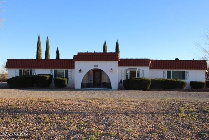 ANOTHER BIG PRICE REDUCTION!!! Beautiful, spacious, 3bd, 2ba home with lovely views and easy access to Interstate 10 and the city of Willcox. This very nice house has been updated and so well taken care of that it feels like a new home!  New appliances in the kitchen, lovely wood beams on the ceiling in the living room and dining room area. It sits on 5 usable acres and with paved access, and a short distance to Interstate 10, so it's convenient to wherever you need to go! Sit on your back porch and enjoy your beautiful lawn with irrigation system and fenced-in yard, while you enjoy the spectacular Arizona sunsets! Nice large workshop, chicken pen, and plenty of room for all your barnyard friends! This is a super nice home in the country, and you don't want to miss this opportunity!!