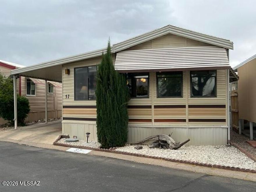 Welcome to Western Way RV Resort, a vibrant 55+ active adult community nestled in scenic Tucson! This charming, fully furnished 1-bedroom, 1-bath manufactured home offers 550 sq ft of comfortable living with stunning mountain and sunset views. Enjoy modern touches like laminate flooring, stainless steel appliances, a full dining area and a cozy breakfast bar. Relax on the covered deck or patio surrounded by low-care landscaping and a tall fence for privacy.  There is also generous covered parking & a storage shed.  Community amenities include pickleball, pool, spa, recreation room, exercise facilities, laundry facilities, water, sewer, garbage and much much more.