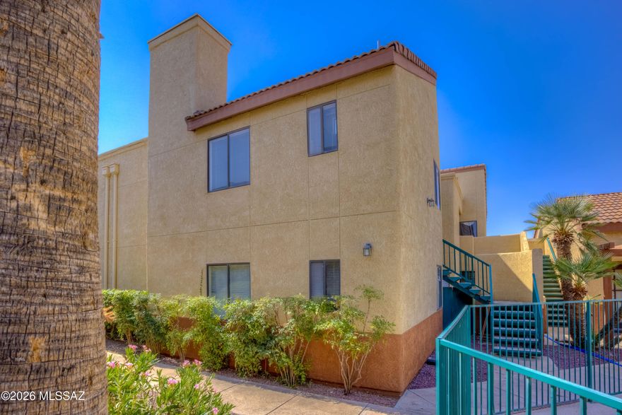 $10,000 Price Drop!! Here's 3 THINGS WE LOVE ABOUT THIS CONDO: 1)High ceilings and lots of light 2)The Location 3) THE Price!  Vaulted ceilings, a wood-burning fireplace, and large windows create an open, airy feel the moment you walk in. The split-bedroom floor plan provides great privacy, with each bedroom featuring its own en-suite bathroom and walk-in closet. Enjoy this central Tucson location just minutes from the Tucson Racquet and Fitness Club, The Loop, The U of A and the Bike Boulevard for easy commuting. Plus the community pool is right outside your door. Whether you're a first-time buyer, student, or investor, this is a smart opportunity to own in a prime location at a great price.