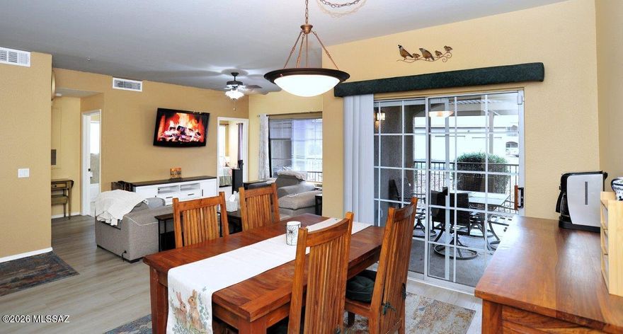 Priced to sell! Oro Valley Boulders at La Reserve. Updated ground level 3 bedroom/2 bath with furniture included!  Split bedrooms with no carpet.  All solid surface flooring with tile in kitchen & baths & luxury vinyl plank everywhere else.  High ceilings & lots of windows allow for plenty of natural light. Lots of room to enjoy the outdoors on the extended covered patio.  Kitchen &  baths have granite.  Primary bedroom includes a walk in closet & full bath.  Patio sun shades. ADT alarm installed.  Home warranty included. Beautiful pool/spa, club house with athletic facility and jogging path.  Excellent location near shopping,medical,golf,restaurants & lots of outdoor activities.  Covered parking space #220. Garage #4 also for sale for $20,000 on a separate bill of sale. Call for showing!