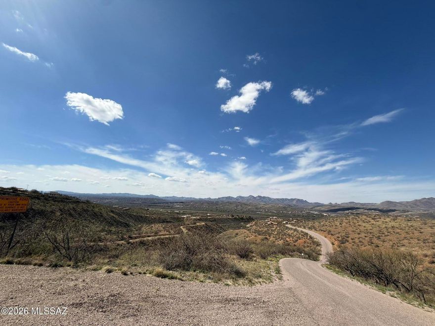 Discover the potential of this beautiful 0.92 acre hill side parcel nestled in the peaceful hills of Rio Rico. Elevated terrain provides sweeping mountain and valley views, offering the perfect setting for a custom home, getaway retreat, or long-term investment. The land features natural desert vegetation, gentle slopes, and a quiet rural atmosphere while still being conveniently close to I-19 for easy access to Nogales, Tucson, shopping, and daily essentials.