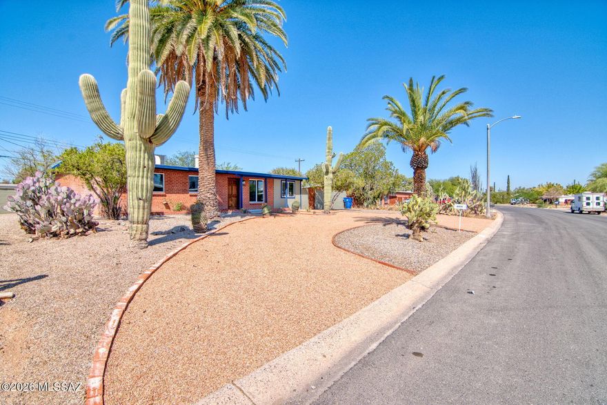 Range priced seller will entertain offers between $375,000 and $385,000. This 1956 built red brick mid-century home has been lovingly restored to better than new condition. New energy efficient windows, new kitchen, with quartz counter tops, wood accents, pendant lighting with a huge island. New custom concrete flooring an open great room plan and so much more. It is 1956 on the outside and all of the functions and amenities you would expect from a new home. Put this home on your short list. The home sits on a a .19 acre lot with a sparkling pool and large patio surrounded by a block wall.  Owner/Agent