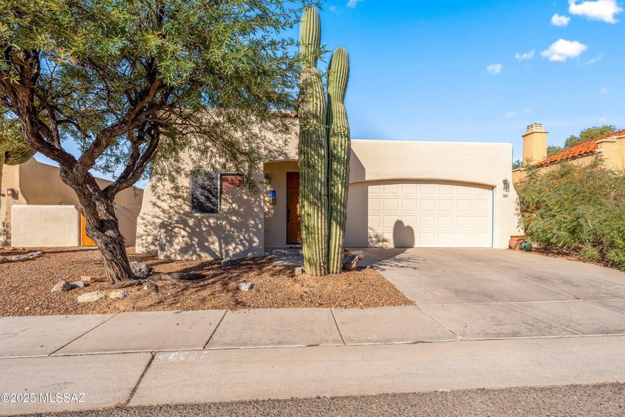 BRAND NEW ROOF on this ever so charming 1,690 sq ft Santa Fe-style home featuring warm wood-plank ceilings in the entryway and tile flooring throughout. The spacious kitchen opens seamlessly to a large living room, creating the perfect layout for entertaining. All three bedrooms and two bathrooms are thoughtfully situated toward the back of the home, offering comfort and privacy. An inviting Arizona room adds year-round flexibility and extra living space. Outside, the expansive backyard backs up to open desert and offers a true blank slate--ready for the new owners to bring their own landscape vision, pool design, or outdoor entertaining ideas to life. A wonderful blend of Southwestern style and functional living.