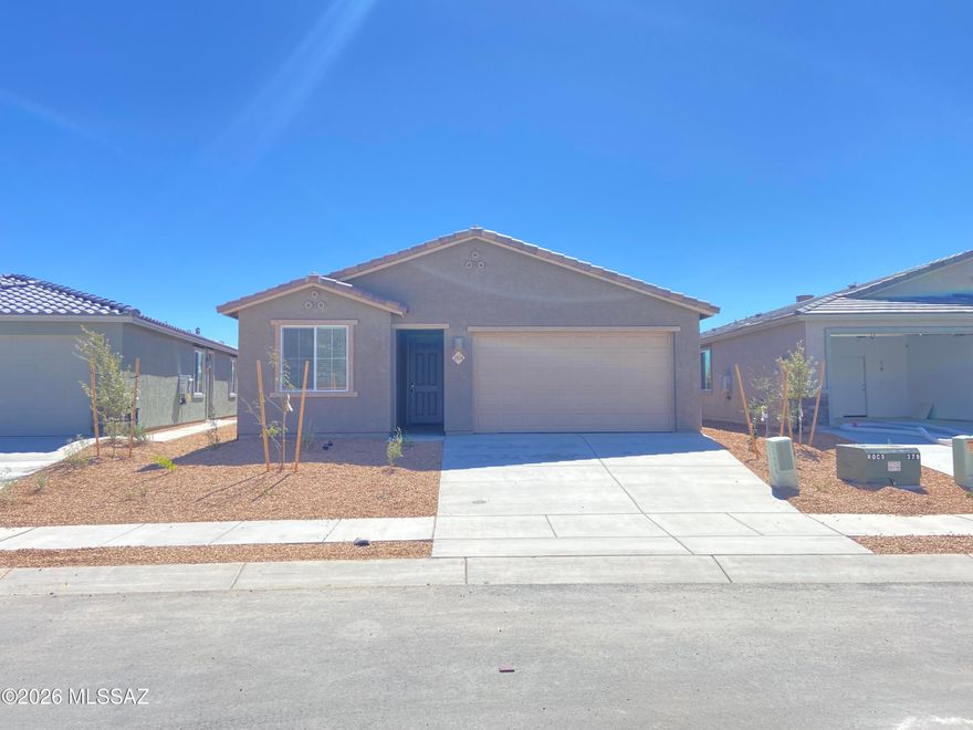 This new single-story home boasts a modern and low-maintenance layout. Three bedrooms feature a secluded location upon entry, leading to an inviting open plan that provides direct access to a covered patio for year-round outdoor leisure. At the back of the home, a private owner's suite provides a tranquil retreat with a full bathroom and walk-in closet. This home includes GE® stainless steal appliances, Rinnai Tankless Water Heater, prep for reverse osmosis, Quartz Countertops, 2'' faux wood blinds, LED lighting and so much more! As an added bonus, this home includes a washer and dryer - move-in ready and waiting for you!