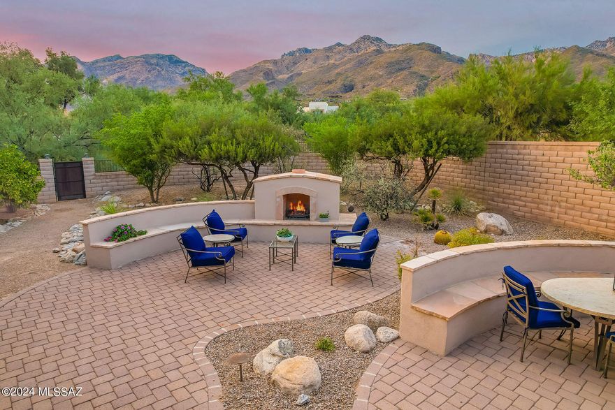 Spectacular home in gated Ventana Reserve. Unobstructed mountain views. Professionally landscaped backyard with fireplace and built in BBQ. Paver driveway leads to a private courtyard entry. The home is all on 1 level with no steps and an open floorplan. Chefs kitchen with all new appliances including Induction stove, stunning granite, custom cabinets, a butlers pantry & a planning desk. Wet bar with wine chiller. All bedrooms are en-suite including a separate casita. Primary bedroom features 2 enormous closets, a sitting area, jetted tub and snail shower. Greatroom is truly great with high ceilings, crown molding, fireplace and big mtn views. Spacious den.  Plantation shutters throughout. Small friendly gated enclave near Ventana Canyon. Perfect for entertaining, a family or lock and go.