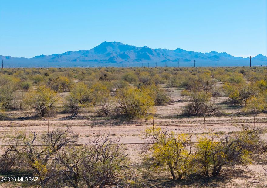 A rare opportunity to own 8.5 acres of desert beauty with panoramic mountain views, and spectacular sunrise and sunset skies! This corner lot is ideal for a custom dream home, offering privacy, space, and stunning natural surroundings. Create your own desert sanctuary with room for a home, casita, RV garage, or workshop — all while enjoying peaceful country living and endless Arizona skies.