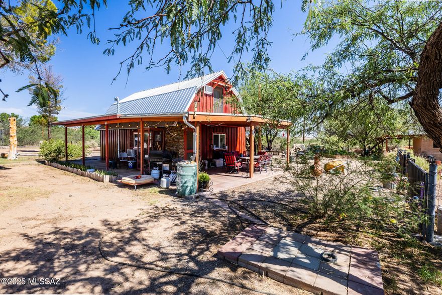 Experience country living with this inviting 2 bedroom 1 bathroom barndominium set on 19 acres. Warm and welcoming, this home features a cozy, pellet burning fireplace and great views of the surrounding landscape. Great for a versatile lifestyle, this property offers horse facilities, a spacious workshop, a charming garden casita, an aviary, a greenhouse and a water fountain. This property provides open space, privacy and blends comfort and beautiful scenery in one great place complete with private well, a new septic installed in 2025. Property is sold ''AS-IS''