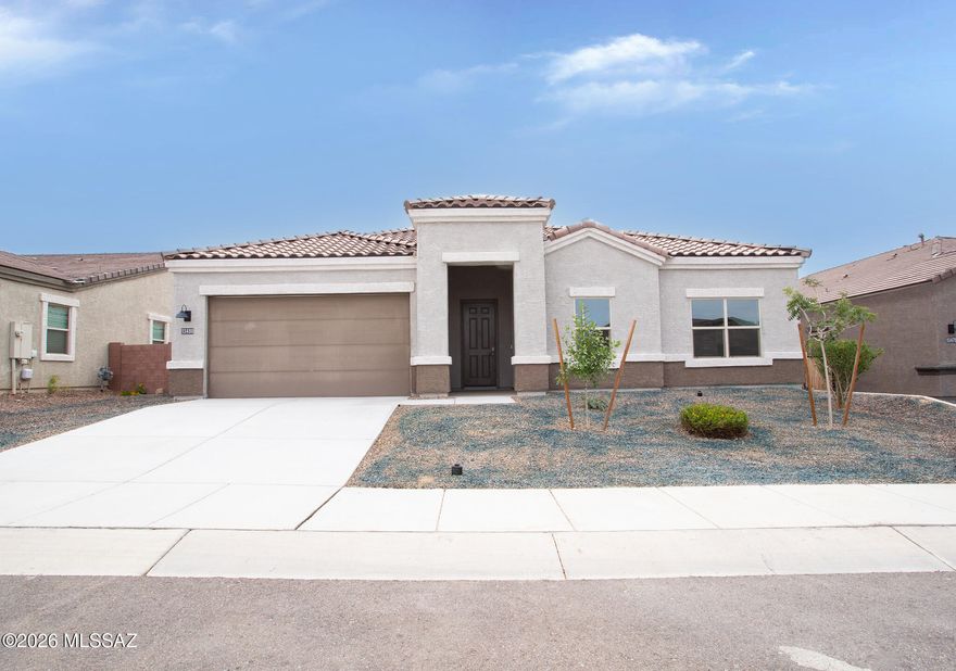 Nestled in the beauty of the Tortolita mountains and one of the most sought-after floor plans in Tortolita Ridge subdivision. With over 2577 sq ft of living space this home offers 4 bedrooms plus a den/office and 3 bathrooms that offers comfortable living space for those seeking room to grow. The thoughtful layout provides distinct areas for daily living and entertaining. This floorplan has a grand and open living design with gourmet kitchen, 11-foot quartz kitchen island and tiled backsplash. Stainless steel appliances, tons of cabinetry, tankless water heater, electric vehicle charging hookup, enclosed patio and backyard with covered patio, pavers and artificial grass. This is a Fannie Mae HomePath property. Move in ready! Contact agent for more information or to schedule a showing.
