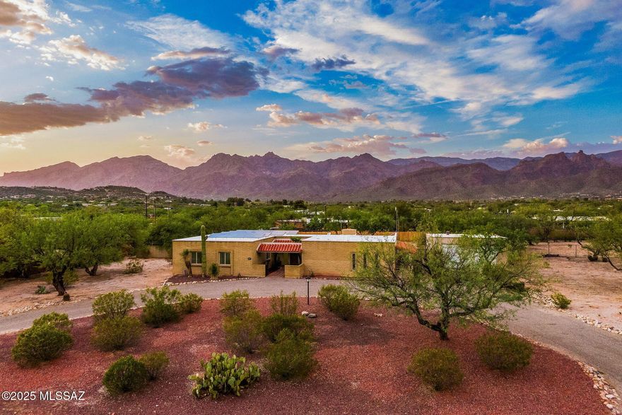 Welcome to your perfect Tucson retreat! This beautifully remodeled 5 bedroom, 4 bath home offers a rare combination of style, comfort, and flexibility, all set against the stunning backdrop of the Catalina Mountains. Located on a spacious lot, it provides the peace and privacy of a getaway while keeping you close to everything you love about Tucson. Inside, you will find bright, open living spaces designed to highlight the incredible mountain views, including a warm and inviting family room with a stylish updated fireplace. The kitchen features sleek quartz countertops, a casual breakfast nook, and elegant finishes that make everyday meals feel special. The primary suite is a peaceful retreat with its own mountain views and a walk-in closet, while each bathroom has been thoughtfully updated with modern style. A standout feature is the private mother-in-law suite with its own living room, perfect for extended family, guests, or a home office. Step outside to enjoy a sparkling pool, expansive patio, and large detached garage, offering endless possibilities for entertaining, hobbies, or storage. Perfectly situated near Mt. Lemmon, scenic hiking trails, and all the charm Tucson has to offer, this home is a place to live, relax, and enjoy life to the fullest.