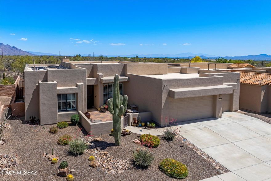 Welcome to your dream home in the highly coveted community of Sky Ranch! Located in a gated enclave, and nestled against protected natural open space, this Marc Soloway-designed masterpiece offers breathtaking mountain and desert views. With 3,515 square feet of thoughtfully designed space, this home features a great room floor plan with a split bedroom layout, including four en suite bedrooms and a versatile fifth bedroom that is perfect for an office or den. Expansive windows flood the interior with natural light, highlighting the soaring ceilings and seamless connection to the surrounding landscape. The chef's kitchen is a showstopper with double ovens, gas cooktop, stainless steel appliances, elegant granite countertops, pull-out shelving and a stone backsplash. Step into your private backyard oasis, beautifully upgraded in 2023 with a solar heated, saltwater pool, spa, and outdoor kitchen. Additional enhancements made in the last five years include a newer HVAC, water heater, interior and exterior paint, and a complete roof re-coat in 8/2025. Stunning curb appeal welcomes you with low maintenance landscaping, a charming front courtyard, and a spacious 3-car garage. Located in a beautifully maintained community where all homes are single story.