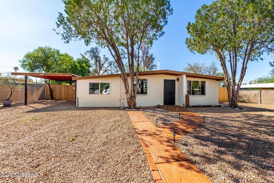 Welcome to this thoughtfully renovated residence! You're greeted by a practical carport for secure parking and a low-maintenance front yard. Inside, you'll find an upgraded interior featuring a living room with vaulted ceilings, recessed lighting, a soothing palette, blinds, and stylish wood-look flooring. You'll also find a well-appointed family room for relaxing evenings with loved ones. The updated kitchen comes with granite counters, crisp white shaker cabinets with crown moulding, a tile backsplash, and sleek stainless steel appliances. The primary bedroom showcases a cozy sitting room and a private bathroom for added comfort. Imagine quiet afternoons in the backyard, which offers a paver patio and a shed for additional storage. Don't miss this revitalized home! Owner/Agent