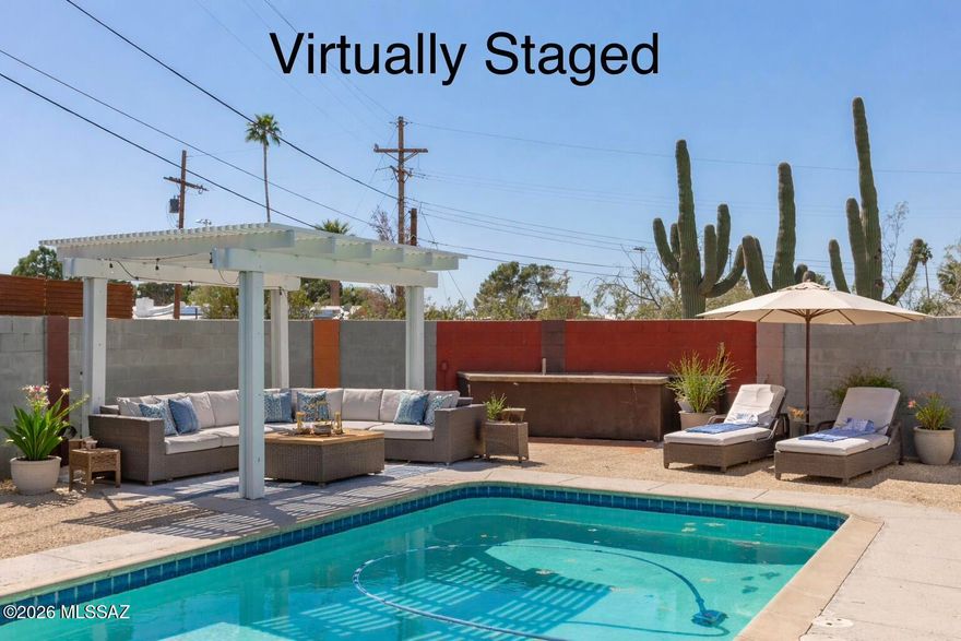 Range price 330k-340k. Your Eastside Oasis Awaits! This stunning 3BR/2BA home perfectly blends indoor comfort with a resort-style backyard. Inside the galley kitchen boasts stainless steel appliances and ample cabinetry, overlooking a spacious living area with a classic fireplace. The primary suite offers a private connection to the outdoors while the guest rooms provide generous living space. The standout feature is the massive, gorgeously landscaped backyard--an entertainer's dream complete with a sparkling pool and low-maintenance turf. Location is everything! A short stroll to Jesse Owens Park with easy access to countless amenities. Just minutes away from shopping, dining, entertainment, hiking trails, Saguaro National Park and more. This is the one you've been waiting for!