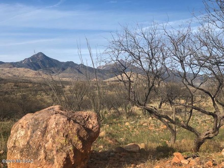 Beautiful rural acreage in the Tubac Foothills Ranch with a SHARED WELL! Plenty of great potential build sites for your new home with mountain views. Cactus, ocotillo, and mesquite trees are on the property along with a creek that runs through the property. There is power to the property line along Via Suerte. Via Suerte is a private road with a locked gate for entry. Tubac Foothills Ranch is on the east side of Tubac and the Santa Cruz River. It is pleasantly secluded, snuggled into the foothills of the Santa Rita and San Cayetano Mountains. Home sites are at least 36 acre parcels and include power and bladed roads to all parcels. Private septic systems handle waste, and water is via private wells accessing an aquifer noted for outstanding purity for all residential needs. Face any point on the compass in this very special enclave and you'll see the great vistas: cinematic views of mountains, sunsets, beautiful hills and valleys, and rock formations. The night skies bring twinkling stars in crystalline skies.